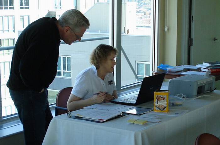 Bob 'Protiles' Schoenman looks on as Jane Bissonnette works with Director!