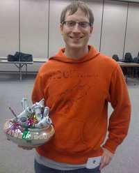 Chris Grubb holding the trophy (with his envelope of prize winnings in his pocket)